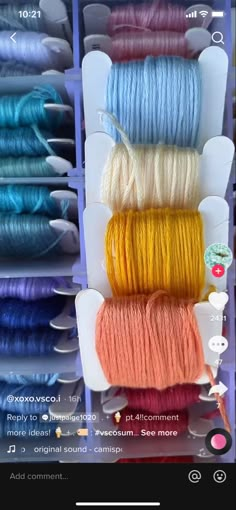 several spools of yarn are in a display case