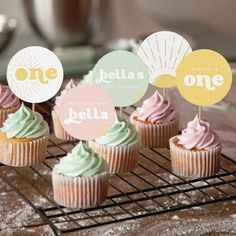 some cupcakes are sitting on a cooling rack