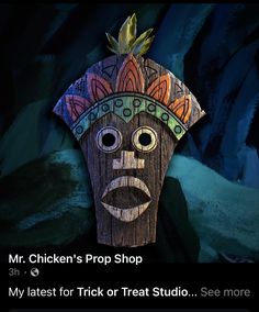 a wooden mask with the words mr chicken's prop shop on it