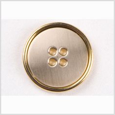 a metal button with four holes in the center on a white background, showing three smaller buttons