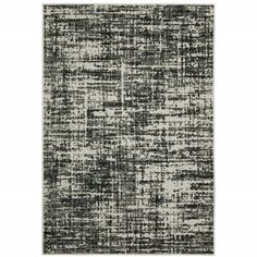 an area rug with black and white colors