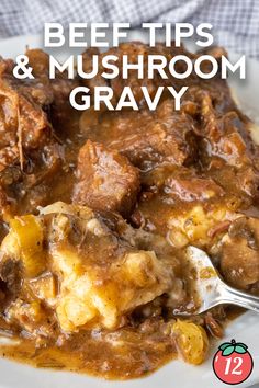 beef tips and mushroom gravy on a white plate with a spoon in it