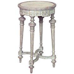 an ornately decorated side table with two legs and a round glass top on one end