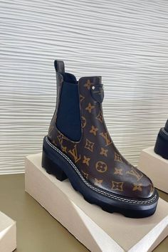 three different types of shoes on display in front of a white box with blue trim