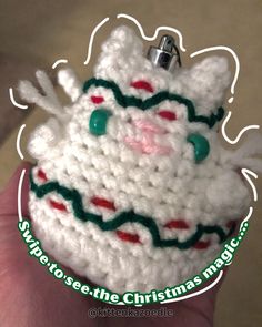 a crocheted christmas ornament is shown in the shape of a cat