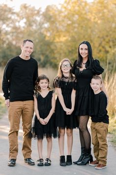 a family posing for a photo on the road