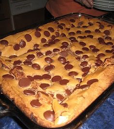 a chocolate chip cookie cake sitting on top of a pan