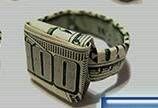 a ring made out of money sitting on top of a table