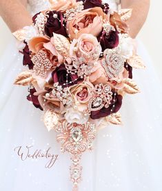 the bride's bouquet is made up of flowers and brooches, including roses