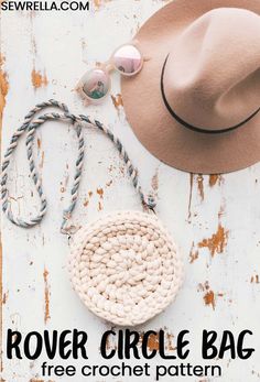 a hat, sunglasses and rope on top of a white wooden surface with text reading rover circle bag free crochet pattern