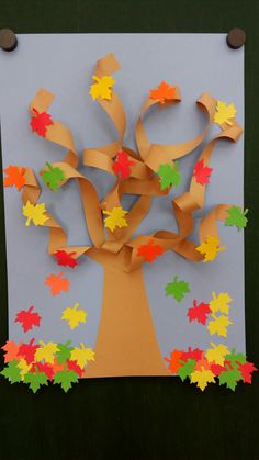 an autumn tree made out of construction paper