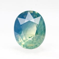 an oval shaped blue and green colored diamond