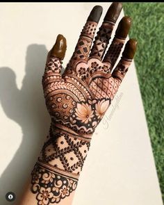 a henna tattoo on someone's hand