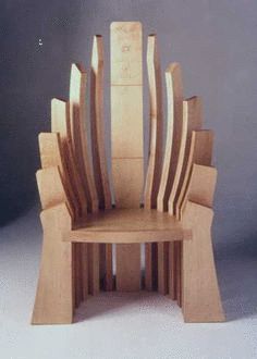 a chair made out of wooden blocks sitting on top of a table