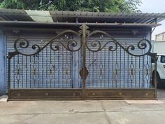 an iron gate in front of a garage