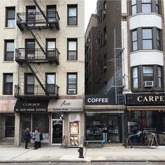 people are walking on the sidewalk in front of coffee shops and apartment buildings with fire escapes