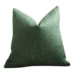 a green pillow on a white background