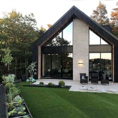 a modern house with an open lawn area