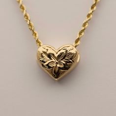 Small Hawaiian Slider Heart Pendant with Engraved Flowers. Available in four designs. Approx. 10.5mm wide. Chain sold separately. Final sale. No returns or exchanges. Item Numbers & Designs: SHP4-HL2Y-V Hibiscus Flower & Leaves in 14K Yellow GoldSHP4-HL1W-V Hibiscus Flower & Leaves in 14K White GoldSHP4-4HLW-V Four Hibiscus Flowers w/ Leaves in 14K White GoldSHP4-DPLY-V Plumeria Flower w/ Leaves & .02ct Diamond in 14K Yellow Gold Hawaiian Wedding Jewelry, Hawaiian Heirloom Jewelry, Flower Leaves, Jewelry Catalog, Heirlooms Jewelry, Jewelry Accessories Ideas, Dope Jewelry, Jewelry Lookbook, Funky Jewelry