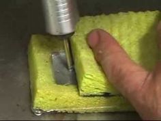 a person using a drill to fix a sponge