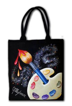 a tote bag with an artist's palette and paint drops on it,