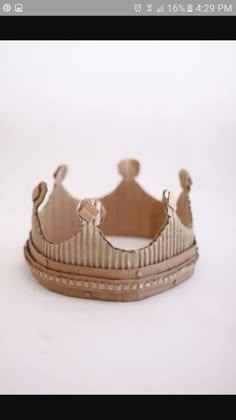 a cardboard crown sitting on top of a white table