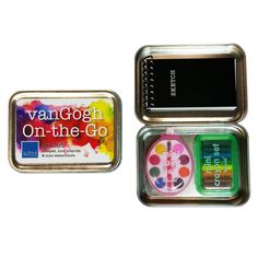 two tins with different colored paints in them