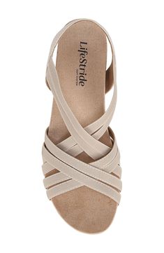 Treat your feet to all-day comfort in this chic strappy sandal balanced on a cork-wrapped wedge with a soft lining and gentle padding. 1" platform Elasticized slingback strap Soft System® comfort package provides all-day support, flex and cushioning Synthetic upper, lining and sole Imported Comfortable Beige Wedge Sandals With Arch Support, Spring Strappy Wedge Sandals With Arch Support, Strappy Synthetic Wedge Sandals With Arch Support, Synthetic Strappy Wedge Sandals With Arch Support, Spring Cream Sandals With Arch Support, Beige Synthetic Slingback Wedge Sandals, Beige Synthetic Wedge Sandals With Heel Strap, Beige Wedge Heel Slingback Sandals, Beige Synthetic Wedge Sandals With Arch Support