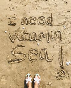 someone's feet in the sand that says i need vitamin sea