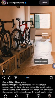 an image of a room with two bikes on the wall and another bike in the background