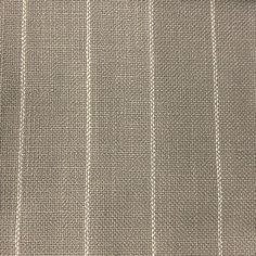 a close up view of a gray and white striped fabric with pinstripe pattern