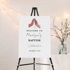 a welcome sign is displayed on an easel