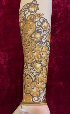 a woman's arm with an intricate design on it