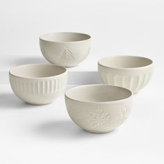 four white bowls with snowflakes on them