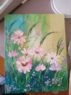 an acrylic painting of pink daisies and green grass