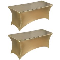 two gold metal shelfs sitting next to each other