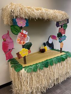 a table that has some decorations on top of it in the shape of a tiki hut