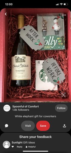 an open red box containing two bottles of wine and some tags on the side of it