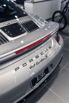 the back end of a porsche car on display