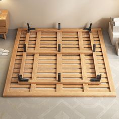 a wooden bed frame sitting on top of a floor