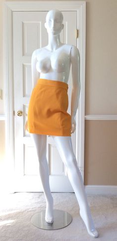 This vintage Moschino skirt is in his iconic taxi cab/school bus yellow. Fully lined in yellow rayon. Side zipper with self button. Front and back shaping seams. Measurements - Waist - 27’Hips - 36”Length - 18” Fitted Yellow Skirt For Fall, Retro School Mini Skirt With Lining, Retro Mini Length Bottoms For School, Retro Fitted Skort For Fall, Fitted Retro Skort For Fall, Yellow Workwear Bottoms Shorts, Yellow Short Bottoms For Work, Yellow Short Length Bottoms For Workwear, Yellow Short Length Workwear Bottoms