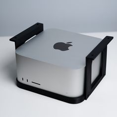 an apple computer sitting on top of a white table