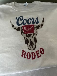 Coors Banquet Rodeo Sublimation Shirt Jerzees Dri-Power brand 50/50 poly cotton blend Large unisex white White T-shirt With Sublimation Print For Fans, White Custom Print Sublimation Design For Fan Merchandise, White Sublimation Print T-shirt For Fans, White Fan Apparel T-shirt With Sublimation Print, White Graphic Tee With Heat Transfer Vinyl, White Graphic Tee With Custom Sublimation Design, White Cotton Sublimation Print Shirt, White Graphic Tee With Custom Print, White Crew Neck Graphic Tee With Sublimation Design