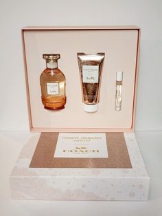 an open box containing two bottles of body care