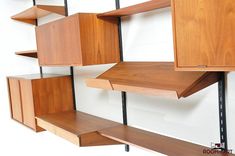 the shelves are made of wood and metal