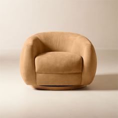 Honey brown leather swivel chair by Los Angeles-based designer Ross Cassidy strikes the perfect balance between modern style and cloud-like comfort. Floating atop a natural oak swivel base, the curved back hugs a generously cushioned seat upholstered in Moore andamp; Giles r polished full-grain leather. The leather's burnished surface is complemented by a velvety texture that will become more visually appealing with age and wear. Naturally milled for a super-soft hand, it's easily one of our mos Leather Swivel Chair, Honey Brown, Caramel Brown, Buffalo Leather, Leather Cleaning, Chic Home, Deep Colors, Top Grain Leather, Leather Chair