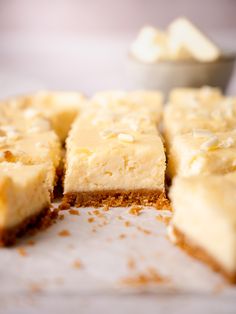 several pieces of cake sitting on top of a table