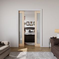 a living room filled with furniture next to a doorway