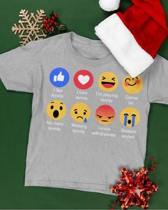 a t - shirt with emoticions on it and a santa hat