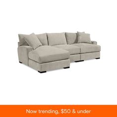 a large sectional couch with pillows on it and the words now trending, $ 50 & under